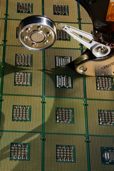 Hard disk drive opened with reflection of processors on the surface of the disk. Background.