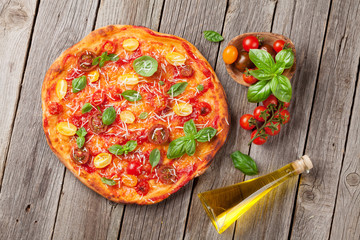 Pizza with tomatoes, mozzarella and basil