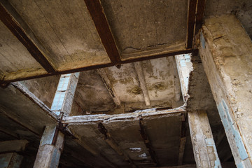 Abandoned concrete construction with destructed ceiling