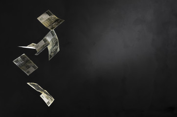 Czech money (2000 crowns banknotes) freeze in motion on black background