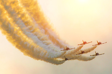 Aircraft fighter jets smoke the background of sky and sun - obrazy, fototapety, plakaty