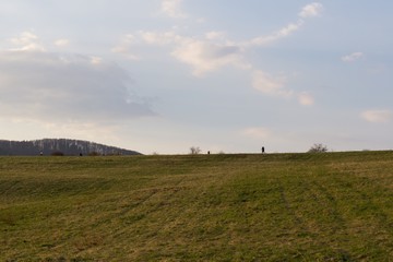People on the horizon of meadow. Slovakia