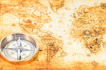 Obraz na płótnie Canvas Old map with an ancient compass