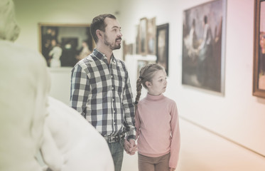Fototapeta premium Father and daughter looking at expositions