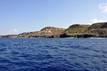 Fototapeta na wymiar Blue sea and characteristic caves of Cala Luna Golfo di Orosei Sardegna or Sardinia Italy