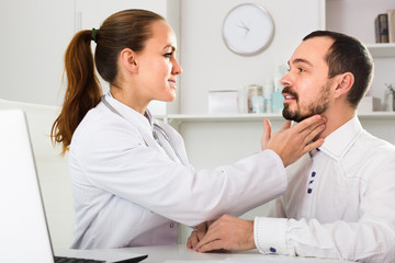 Male client visiting consultation with woman doctor