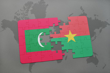 puzzle with the national flag of maldives and burkina faso on a world map