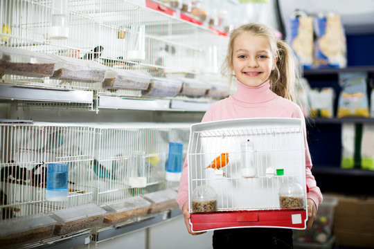 Girl enjoying her purchase of canary bird
