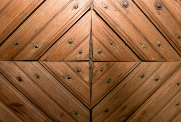 Wooden doors with a pattern in the form of a triangle