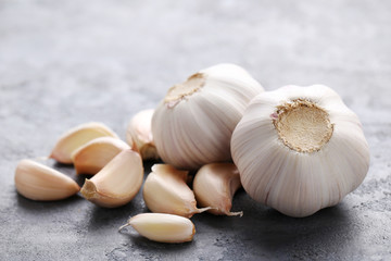 Garlic on the grey wooden table