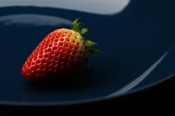 strawberry in blue porcelain dish 