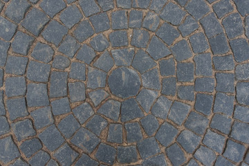 Gray paving stone paved with a pattern