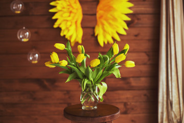 bubbles. vase with tulips. yellow wings