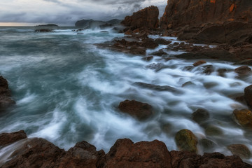 Waves and foam in the Cantabrico sea, in Bermeo
