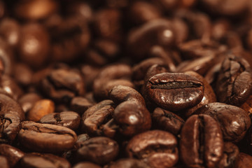 Dark many roasted coffee beans texture background