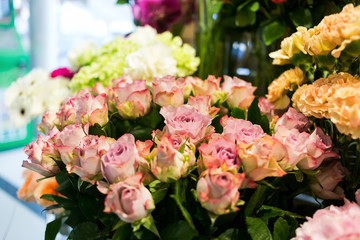 bouquet of roses,Colorful roses and other flowers at the entry to flower shop,Bouquet decorate in front of flower shop,Many flowers in the market,flowers at farmers' market