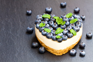 Valentines  day dessert. Heart shaped cheesecake with blueberry.