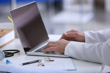 Male doctor at work in clinic
