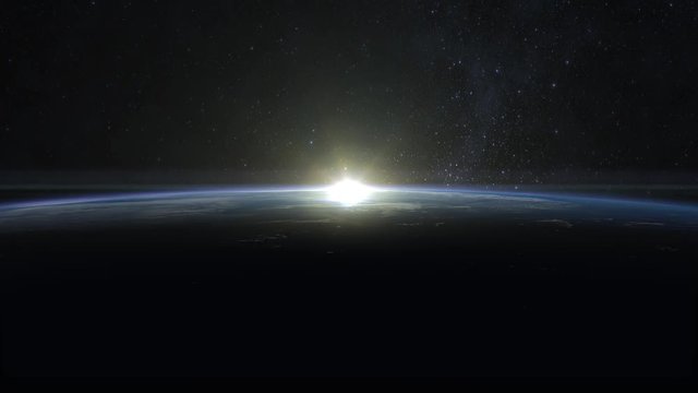 Sunrise over the Earth. The earth rotates quickly. Volumetric clouds. View from space. Beautiful starry sky. 4K.