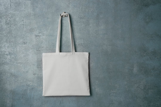 White textile bag on grey background