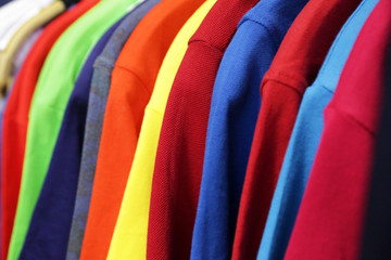 Different clothes on hangers, closeup