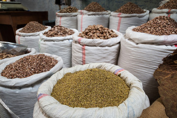 A lot of seeds and chopped mushrooms in several sacks at the Zegyo (also known as Zay Cho) Market in Mandalay, Myanmar (Burma).