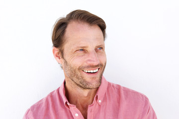 Obraz premium Close up smiling man against white background