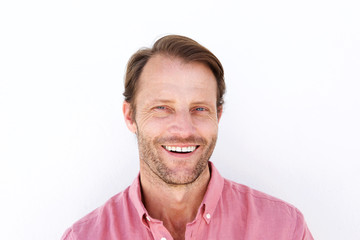 Close up attractive man smiling against white background