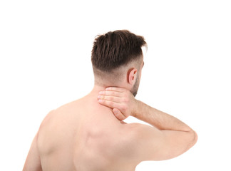 Naklejka premium Young man suffering from neck pain on white background