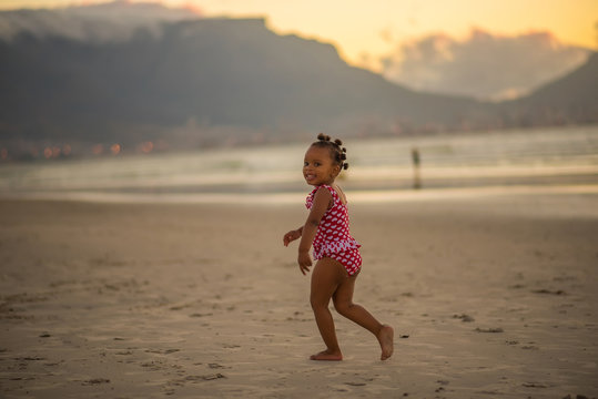 Little girl having fun at the beach