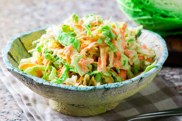 Cabbage salad cole slaw in a ceramic bowl