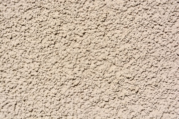 Close up uneven plaster surface texture background