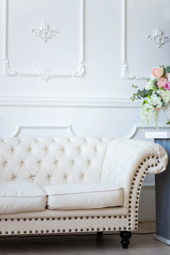 white leather sofa in a photo Studio salon interior colors © liliyabatyrova