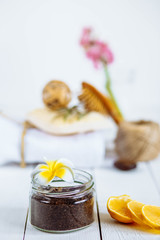 Body scrub of ground coffee aloe vera sugar and lemon on white background, homemade cosmetic for peeling and spa care,keep the moisture of your skin.Good and easy spa product you can make at home.