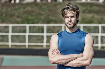handsome fashionable man has stylish hair in sportswear, sport fashion