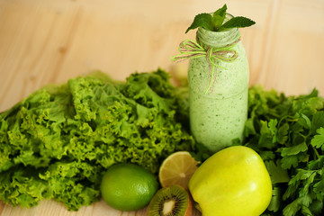 healthy food concept. milkshake in glass and fresh green vegetables. detox diet