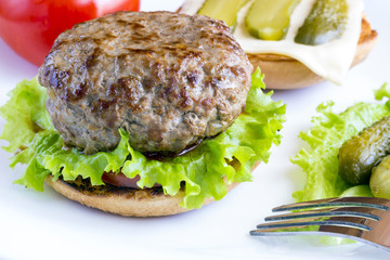 Homemade hamburger on white plate