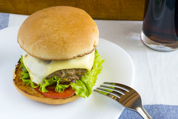 Homemade hamburger on white plate