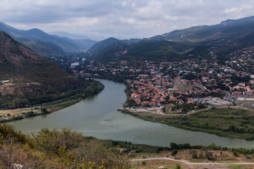 Fototapeta premium View to confluence Aragvi and Mtikvari rivers and town of Mtsheta from Jvari church. Georgia