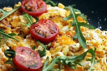 Traditional breakfast - fried eggs,ruccola, tommato- - diet concept scrambled eggs