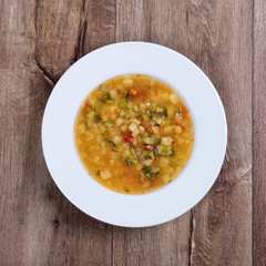 Vegetable soup on a wooden table