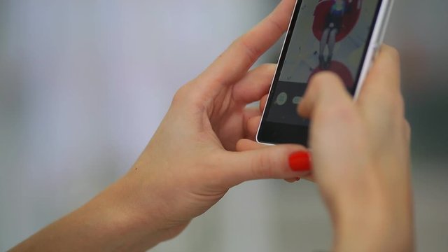 Doctor in a dental clinic takes pictures of a patient on a smartphone