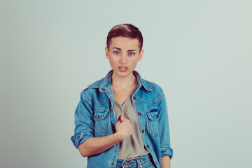 Angry, unhappy, annoyed young woman, getting mad, asking question you talking to me, you mean me?