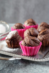 Chocolate muffins on vintage tray. Focus selective