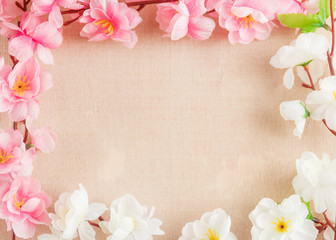 Frame of spring flowers on a wooden ,with space for text ,spring or summer theme