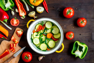 ingredients for vegetable ragout on wooden background top view
