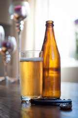 beer bottles and a glass on a table