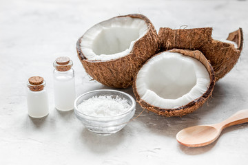 Fototapeta na wymiar cosmetic concept with fresh coconuts on white table background