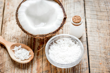 coconut oil for body care in cosmetic concept on old wooden table
