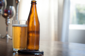 beer bottles and a glass on a table
